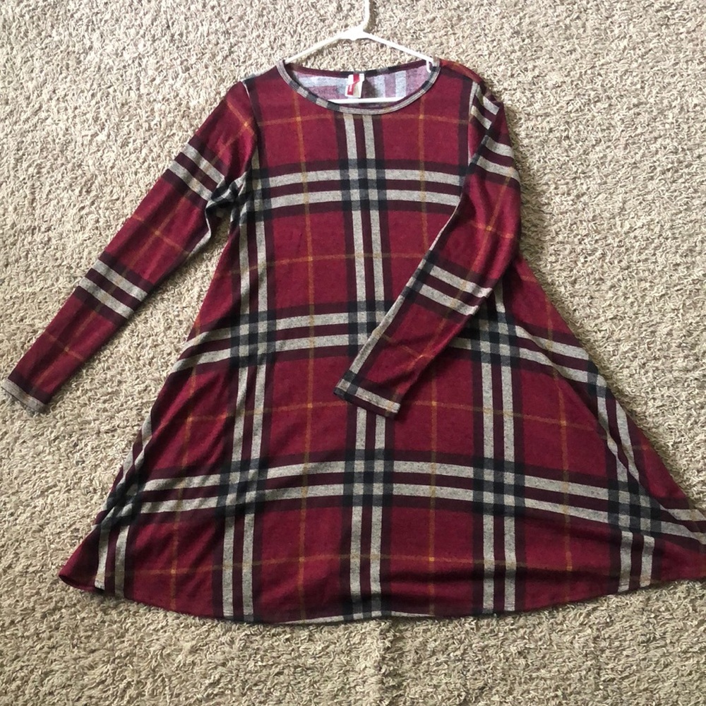 Never been worn. Maroon plaid long sleeve dress.